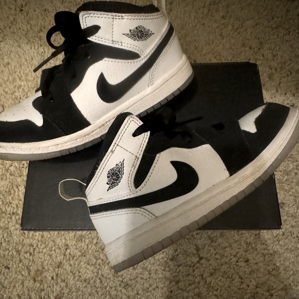 Black and white Nike Air Jordan’s